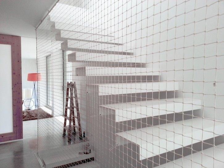 Staircase safety nets installed across open stairwell